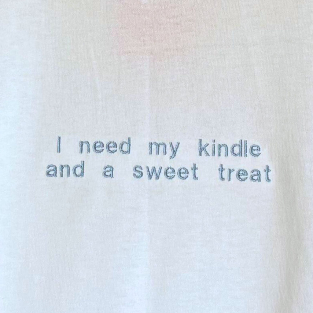 "I need my kindle and a sweet treat" embroidered T-shirt
