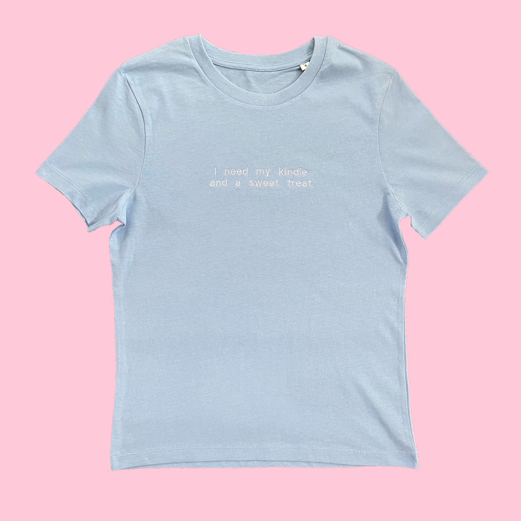 “I need my kindle and a sweet treat” - Embroidered light blue T-Shirt