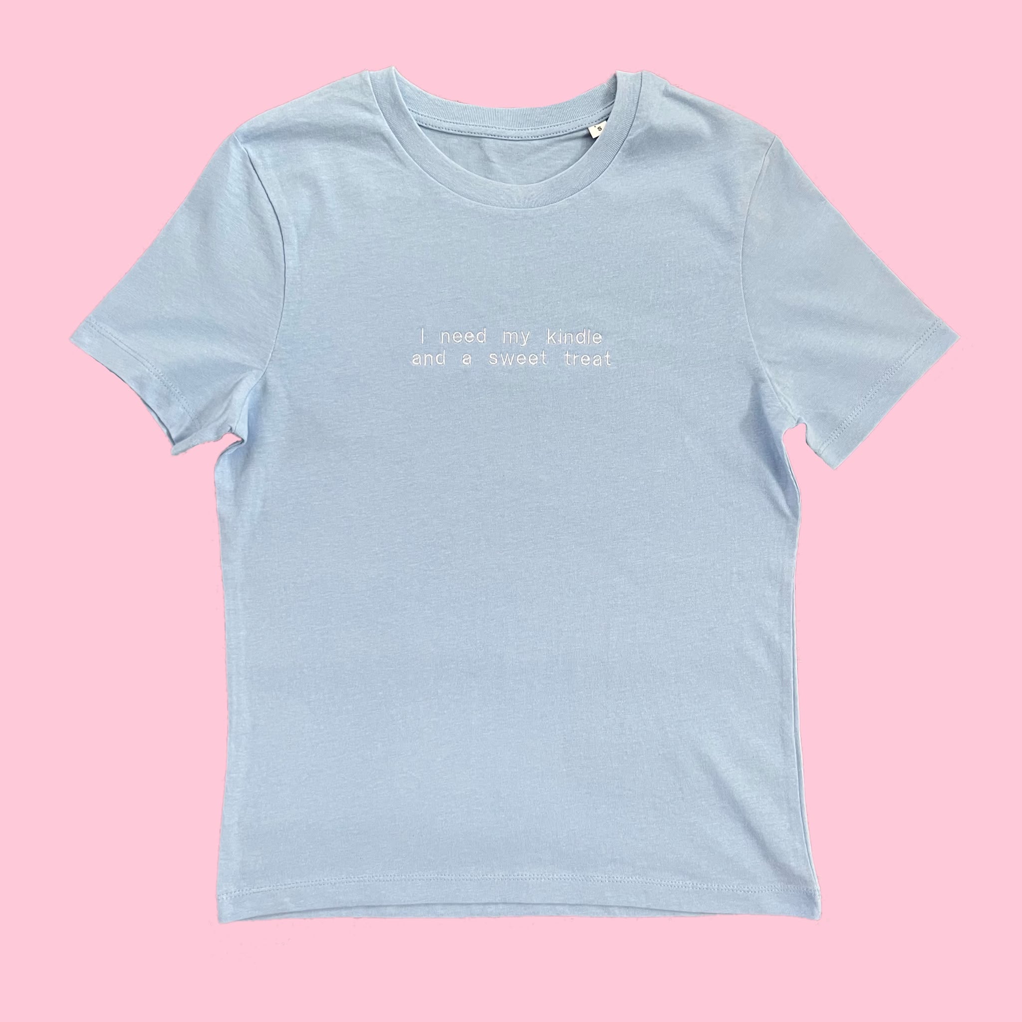 “I need my kindle and a sweet treat” - Embroidered light blue T-Shirt
