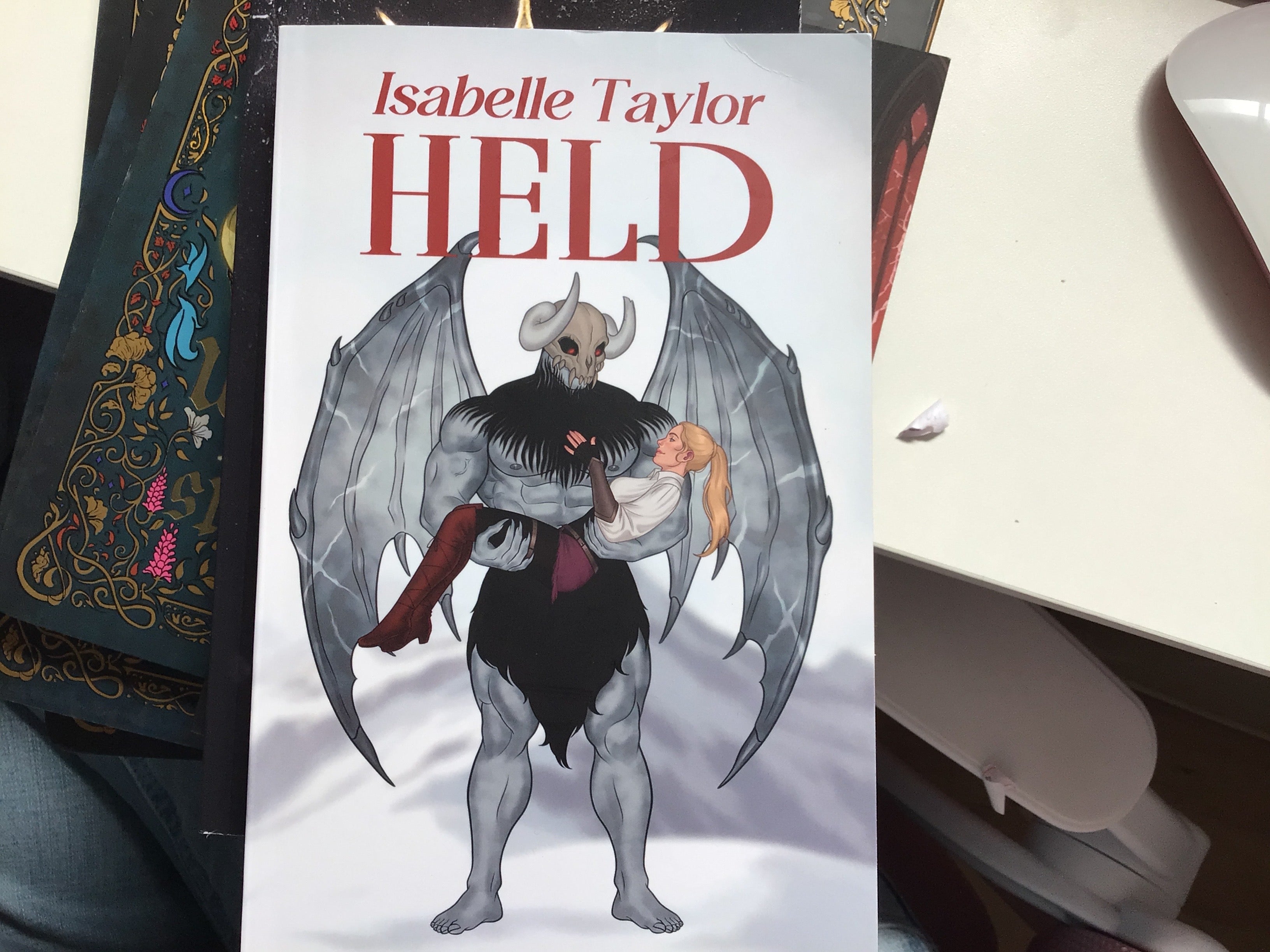Held by Isabelle Taylor