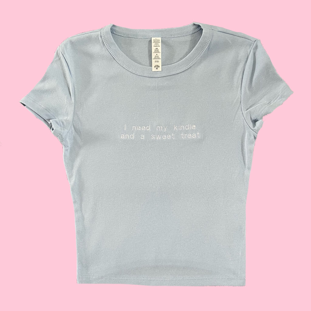 “I need my kindle and a sweet treat” - Embroidered T-Shirt