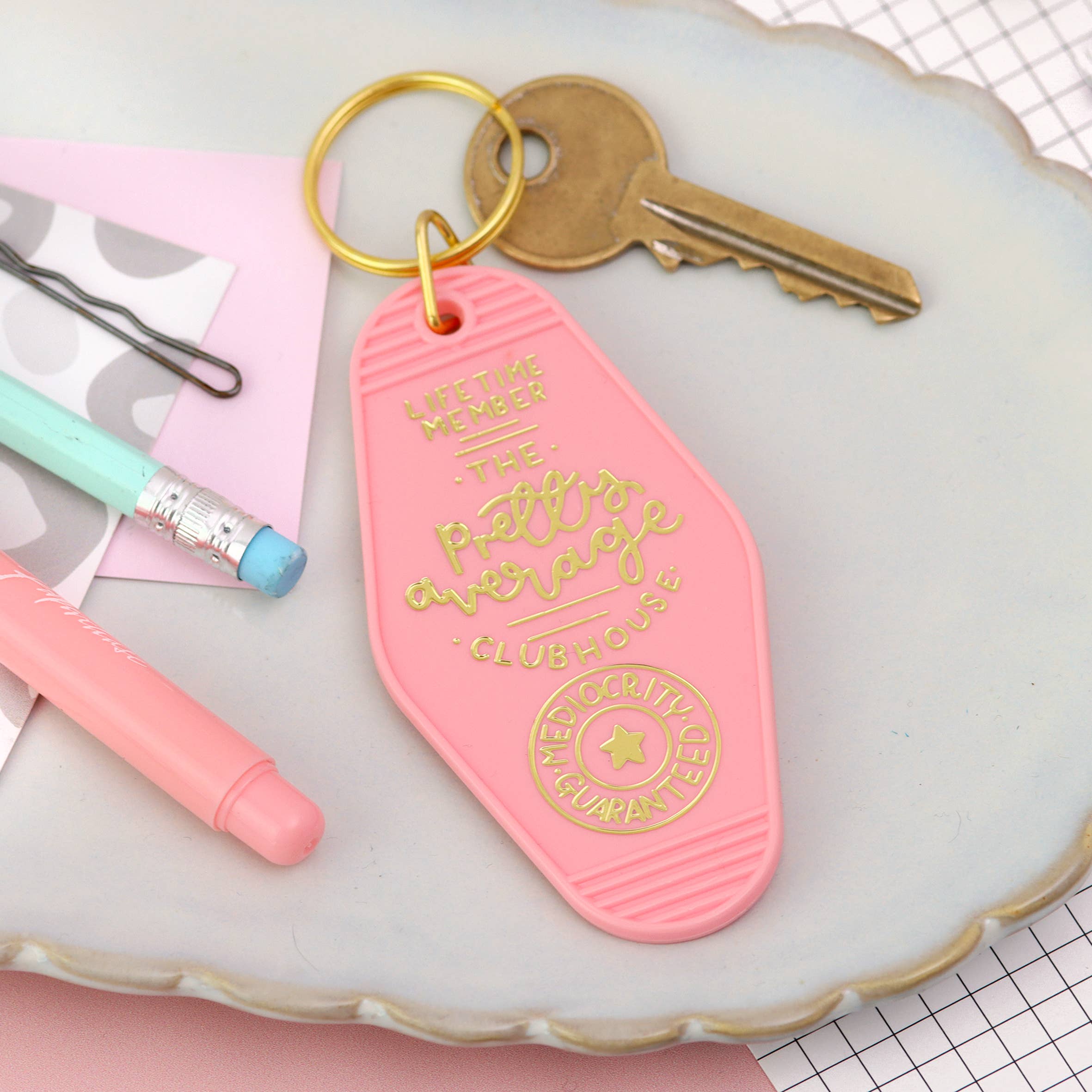 Laura Oh - the pretty average clubhouse keyring