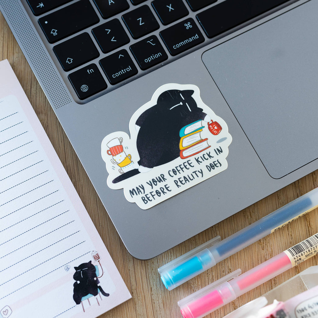 "May your coffee kick in before reality does" sticker