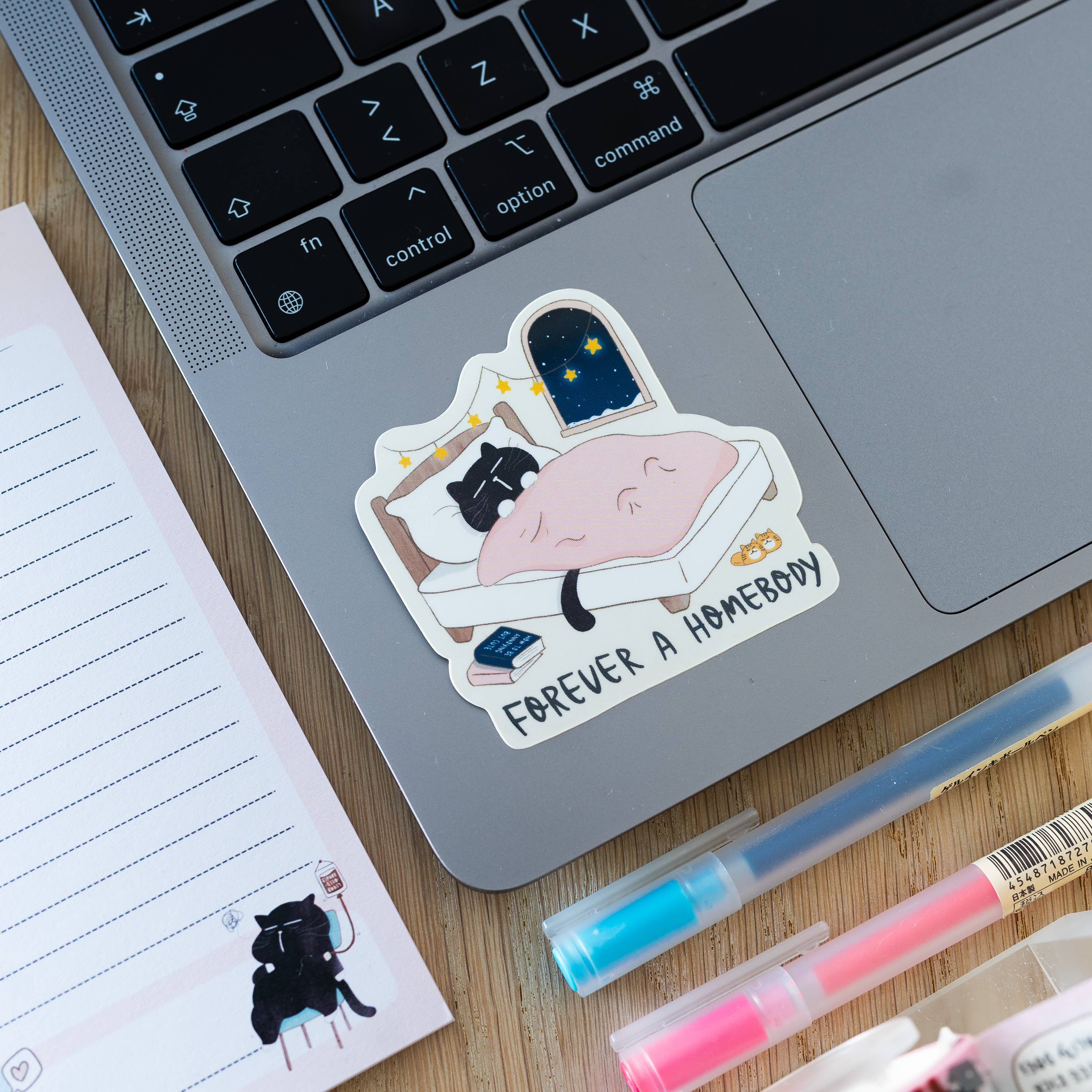 "Forever a homebody" cozy black cat sticker